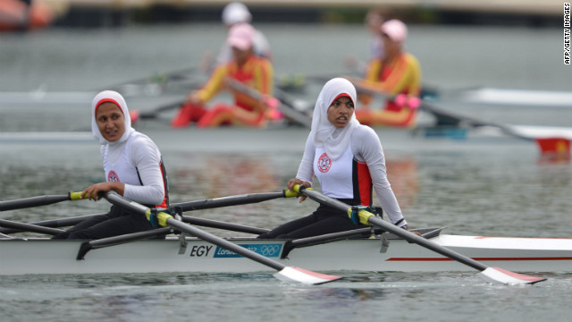 Egypt's Sara Mohamed Baraka, right, and Fatma Rashed rest after competing in the women's rowing lightweight double sculls repechages event Tuesday.