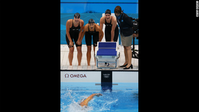 From left, Shannon Vreeland, Dana Vollmer and Missy Franklin watch teammate Allison Schmitt finish first to win the relay.