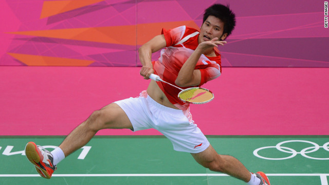 Derek Wong of Singapore returns against Jan O Jorgensen of Denmark during their men's singles badminton match.