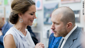 Apple design chief Jonathan Ive chats with Kate Middleton at an event in London on July 30.