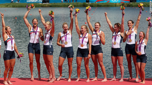 Members of the U.S. rowing team celebrate with their gold medals during the medal ceremony after the women's eight final at Eton Dorney in Windsor, England.