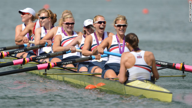 The U.S. team poses on their boat after winning their gold medals.
