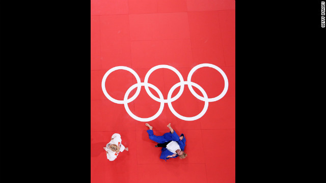 American Kayla Harrison, in white, and Gemma Gibbons of Britain compete in women's judo on Thursday. 
