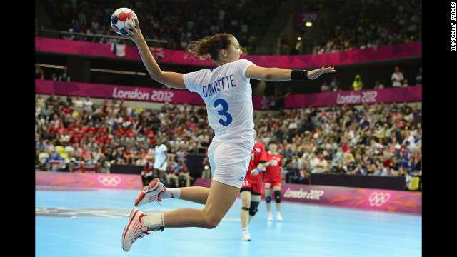 France's Blandine Dancette jumps to shoot during a women's preliminary handball match between South Korea and France.