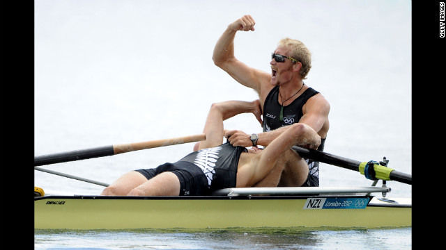 Hamish Bond and Eric Murray of New Zealand celebrate after winning gold in the men's pair at the Olympic rowing regatta.