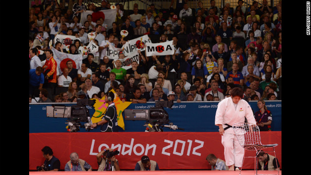 Japan's Mika Sugimoto salutes the mat after winning the women's over 78-kilogram judo quarterfinal.