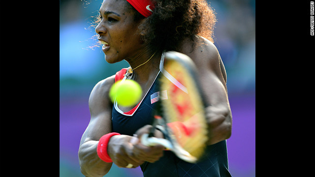 U.S. player Serena Williams makes a return against Victoria Azarenka of Belarus during their women's singles semifinal.