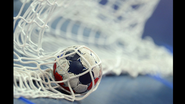 A ball appears in the net of a goal during the women's preliminary handball match between Russia and Brazil.