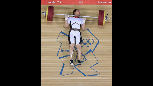 Egypt's Khalil Mahmoud K Abir Abdelrahman fails to complete a lift during the women's 75-kilogram weightlifting final.