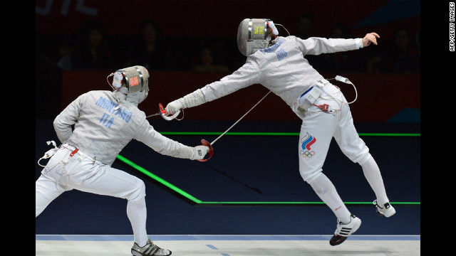 Italy's Aldo Montano, left, fences against Russia's Alexey Yakimenko during the men's sabre bronze medal match as part of the fencing event on Friday.
