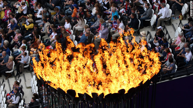 The Olympic Cauldron burns at the Olympic Stadium. 