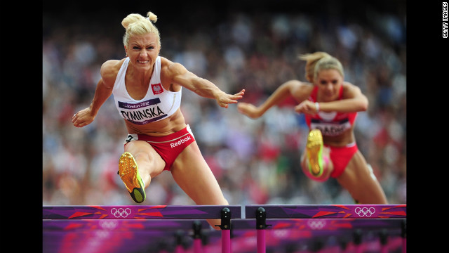Poland's Karolina Tyminska, left, competes in the women's heptathlon 100-meter hurdles heat.