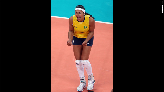 Paula Pequeno of Brazil celebrates a point in the first set against China during women's volleyball.