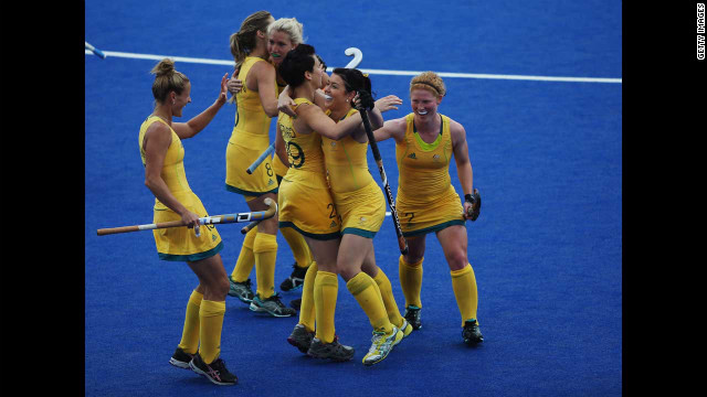 The Australian women's hockey team celebrates during a preliminary round group B match against South Africa.