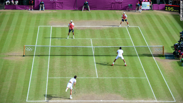 France's Michael Llodra and Jo-Wilfried Tsonga compete against Mike Bryan and Bob Bryan of the United States in the men's doubles final.