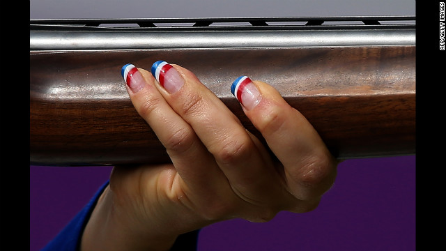 France's Delphine Reau competes in the women's trap shooting final at the Royal Artillery Barracks in London. She won the bronze medal.