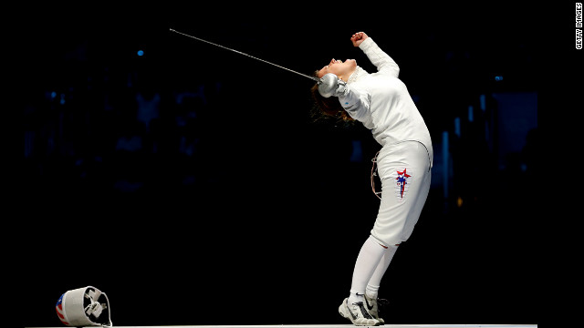 Courtney Hurley of the United States celebrates after she and her teammates defeated Russia in the the bronze medal match, 31-30, in women's epee team fencing.