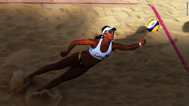 Maria Antonelli of Brazil dives for the ball during a women's beach volleyball round-of-16 match between Brazil and the Czech Republic.