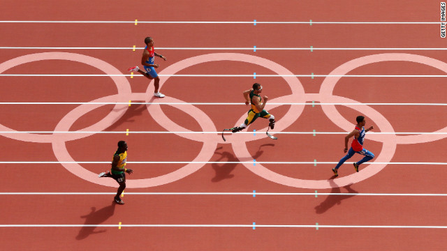 Rusheen McDonald of Jamaica, Luguelin Santos of the Dominican Republic, Oscar Pistorius of South Africa and Maksim Dyldin of Russia compete in the first round of the men's 400-meter on Saturday.