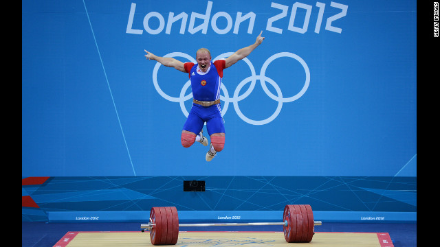 Andrey Demanov of Russia celebrates during the men's 94kg weightlifting final.