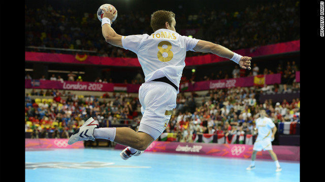 Spain's rightwing Victor Tomas Gonzalez jumps to shoot during the men's preliminary handball match against Hungary.