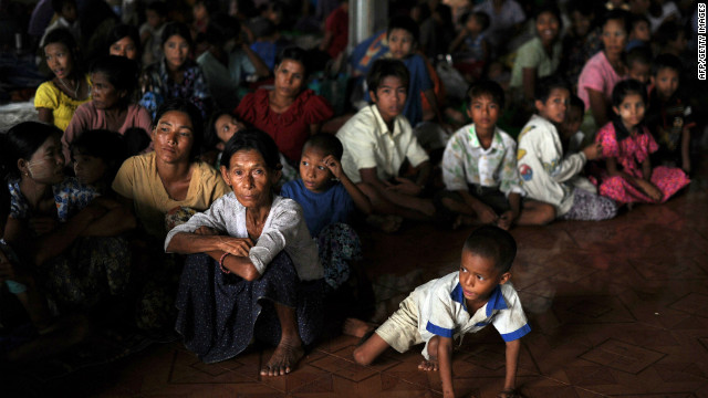 People displaced by sectarian violence sit at a monastery used as a temporary shelter in Sittwe, Myanmar.