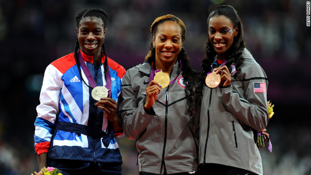 From left, silver medalist Christine Ohuruogu of Great Britain, gold medalist Richards-Ross and bronze medalist DeeDee Trotter of the United States show off their medals during Sunday's ceremony at Olympic Stadium in London.