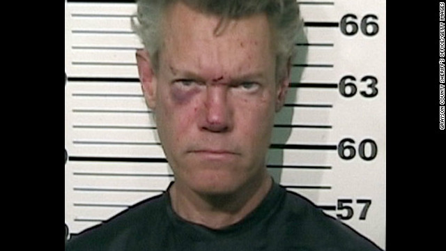 Musician Randy Travis was arrested August 7 for misdemeanor DWI and felony retaliation after he was involved in a one-vehicle accident and found buck naked in the roadway. He was later released on bond. 