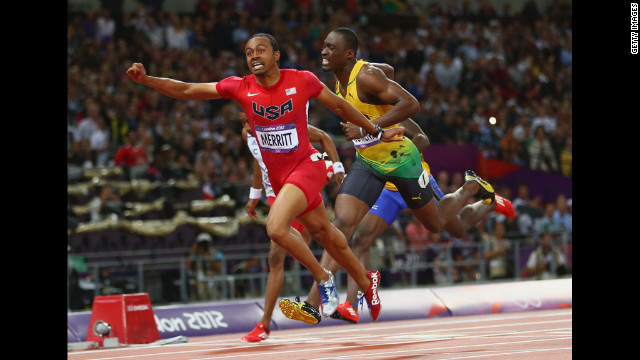 Aries Merritt of the United States crosses the finish line ahead of Hansle Parchment of Jamaica to win gold in the men's 110-meter hurdles final.