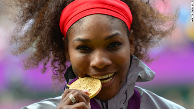 Serena Williams of the U.S. poses on the podium with her gold medal after defeating Russia's Maria Sharapova in the women's singles gold medal match.