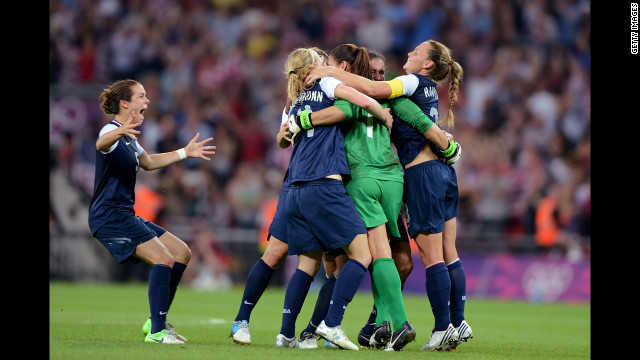 The United States women's soccer team celebrates after defeating Japan, avenging its 2011 World Cup final loss.