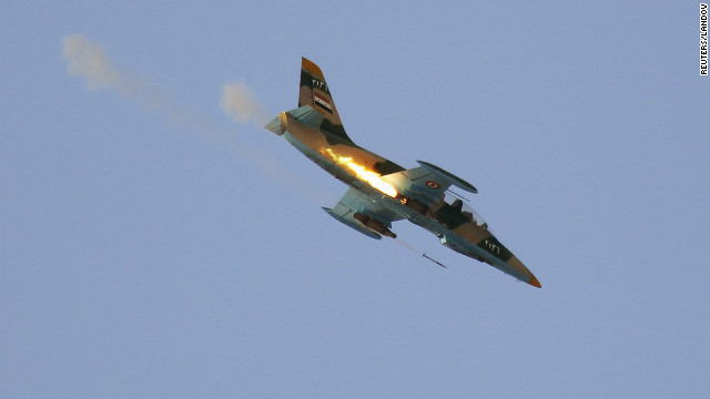 A Syrian air force fighter plane fires during an airstrike Thursday in Tel Rafat, north of Aleppo. Forces loyal to the regime have been shelling Aleppo, Syria's largest city.