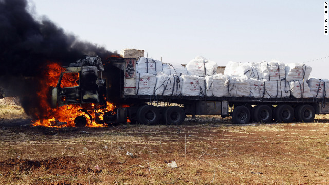 A truck burns after apparently being hit by rockets during an airstrike on Tel Rafat.