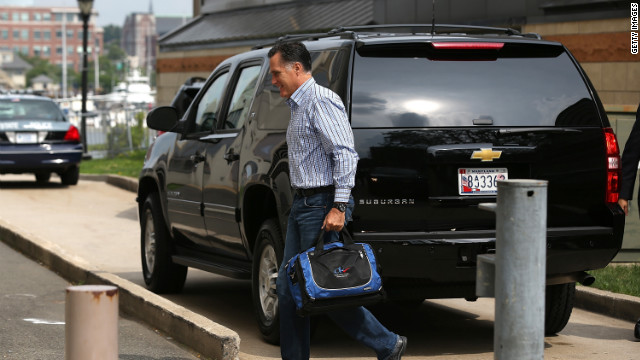 Mitt Romney arrives at his campaign headquarters Friday in Boston.