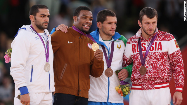 From left to right: Silver medalist Sadegh Saeed Goudarzi of Iran, gold medalist Jordan Ernest Burroughs of the U.S. and bronze medalists Soslan Tigiev of Uzbekistan and Denis Tsargush of Russia on the podium of the men's 74-kilogram freestyle.