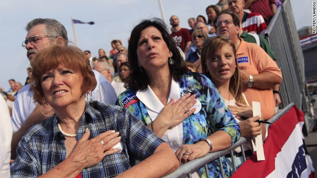 Romney supporters sing the U.S. national anthem as they wait for Romney to introduce Ryan as his vice presidential running mate.