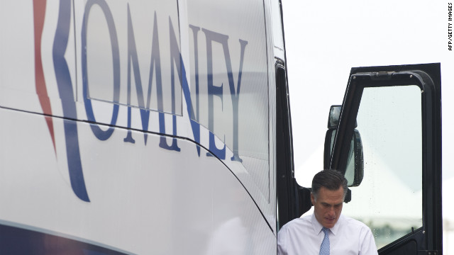 Romney exits his bus at the campaign event.