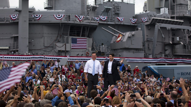 Romney, left, and Ryan wave at supporters in front of the USS Wisconsin.