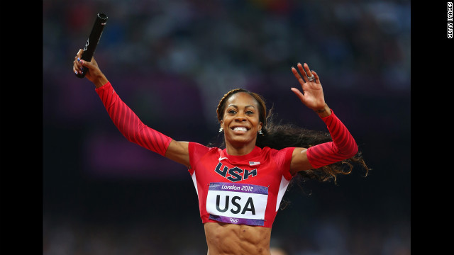 Sanya Richards-Ross of crosses the finish line to win gold for her team.