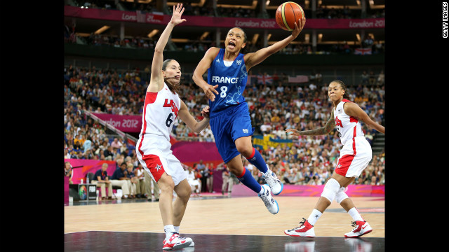  France's Edwige Lawson-Wade, in blue, goes up for a shot against Sue Bird in the second half.