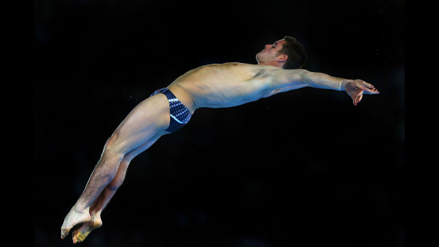 American David Boudia performs a dive in the the men's 10-meter platform diving final. He won gold with China's Bo Qiu taking silver and Great Britain's Tom Daley winning bronze.