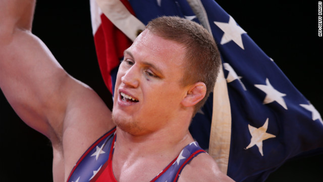 U.S. wrestler Jacob Varner waves the Stars and Stripes after winning the gold medal in the men's 96-kilogram freestyle event on Sunday, August 12.