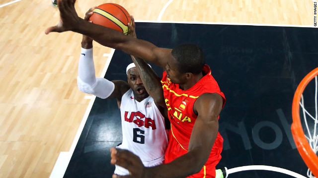 LeBron James goes up for a shot as Serge Ibaka of Spain attempts to block.