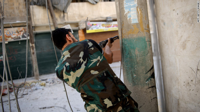 A rebel fighter fires at government forces Monday in Aleppo's Salaheddin neighborhood.