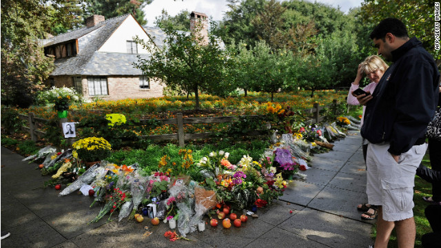 Mourners place flowers outside the Palo Alto, California, home of Apple co-founder Steve Jobs after his death last year.