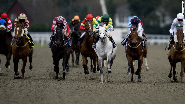 Sakhee Pearl, ridden by Ian Mongan, claims victory in a handicap race at England's Kempton Park racecourse in 2011. 