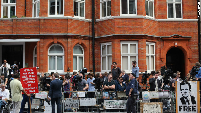 Media gather outside the Ecuadorian Embassy in London after Thursday's announcement. Meanwhile, Britain vowed to extradite the WikiLeaks founder to Sweden to face questioning on sex crime charges.