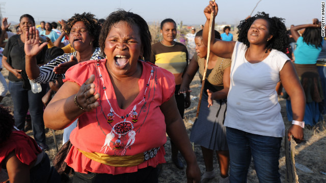 Protesters gather in Marikana, South Africa, on Friday, August 17, at the scene where 34 people died a day earlier after police opened fire on striking mineworkers. Police say they fired at the striking workers in self-defense. Marikana was one of the bloodiest incidents since the end of apartheid in 1994. 