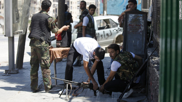 Members of the Free Syrian Army prepare their weapons in Aleppo's Saif al-Dawla district on Monday, August 20.