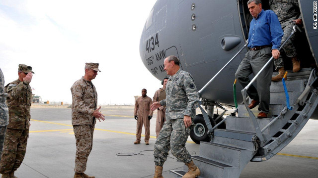 Gen. Martin Dempsey, center, is welcomed to Afghanistan. The plane the general arrived in was later hit by shrapnal from two rockets while parked overnight at Bagram Air Field, outside Kabul.